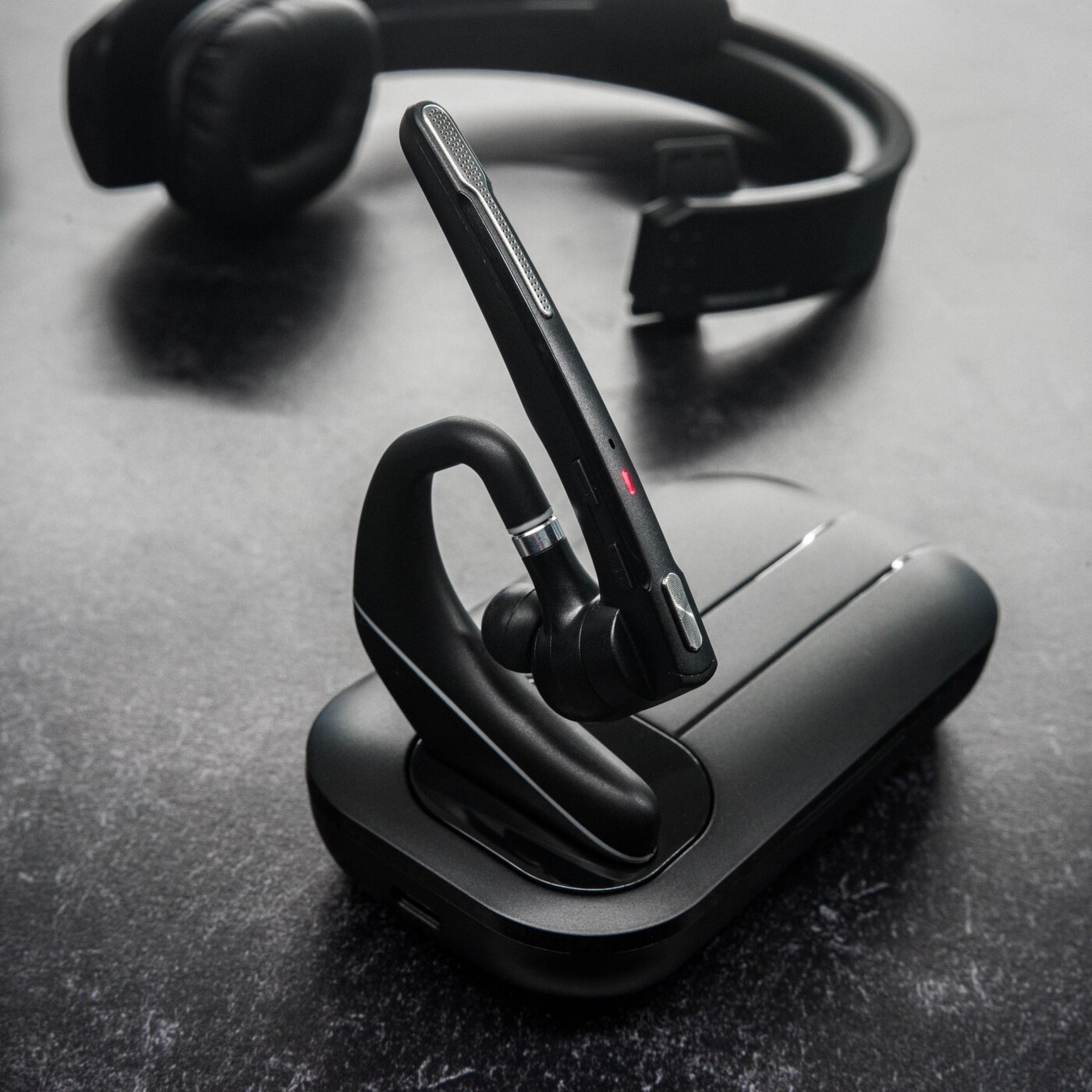 Black & Gray headset placed on its charging dock