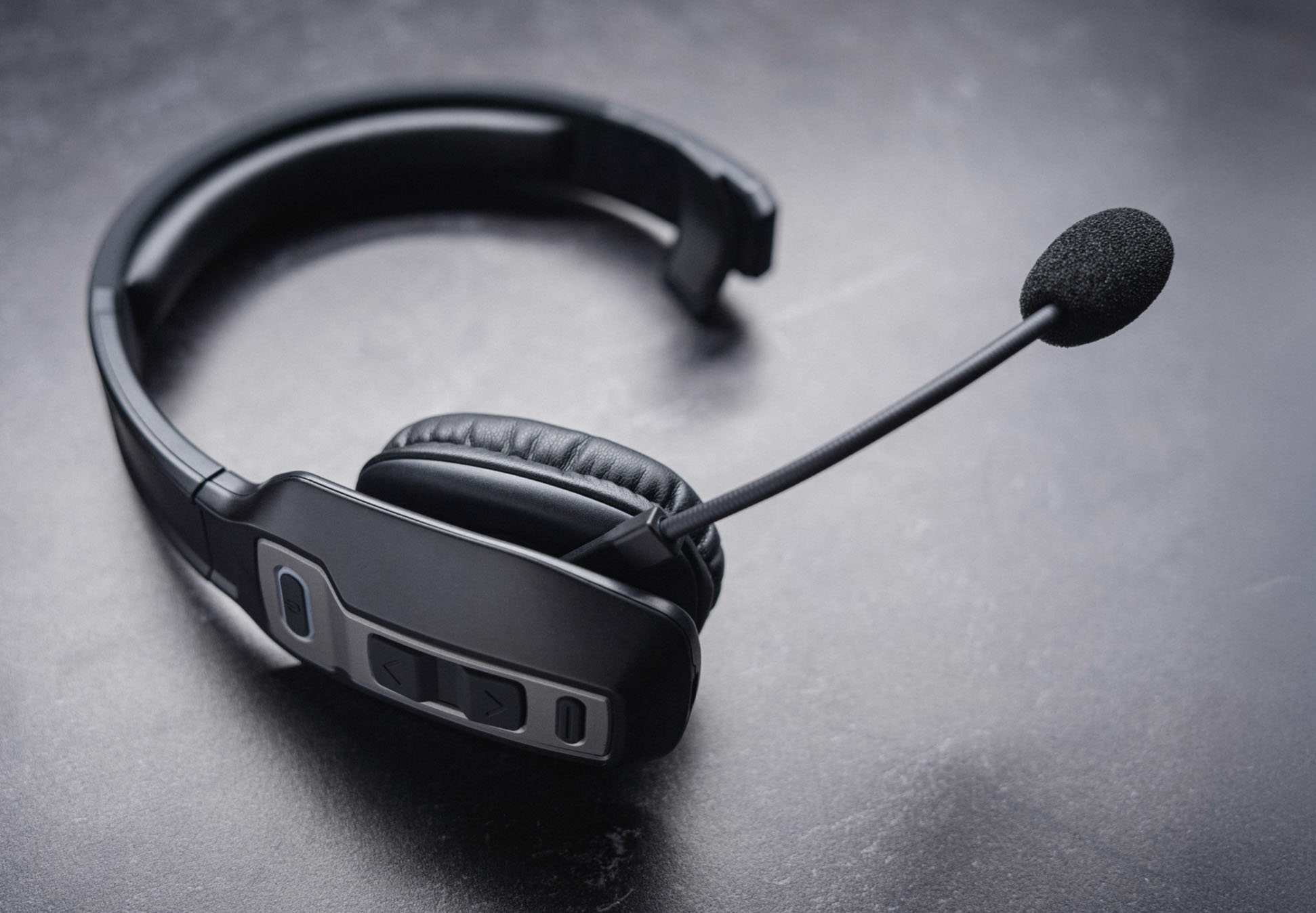 Black & Gray headset photographed on a dark studio surface