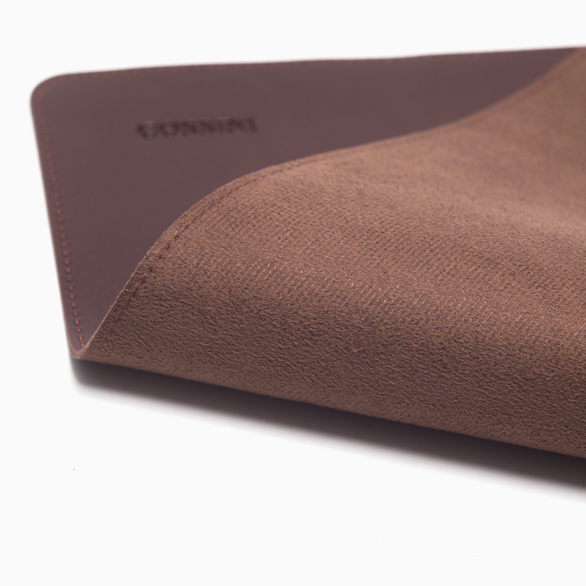 Cossini leather desk mat photographed on white